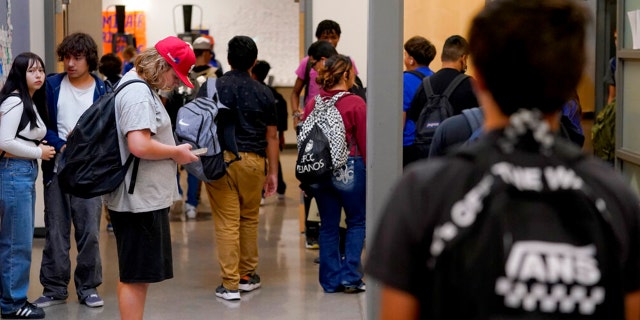 Westwood High School students make their way to classes, Oct. 18, 2022, in Mesa, Arizona.