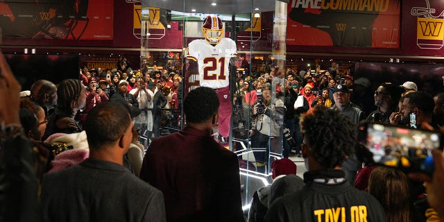 Fans attend the dedication of the Sean Taylor Memorial, prior to the start of the Atlanta Falcons and Washington Commanders game, Sunday, November 27, 2022, in Landover, Maryland.