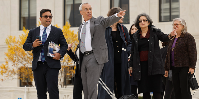 Attorney Seth Waxman, second from left, leaves the U.S. Supreme Court after oral arguments on Oct. 31, 2022, in Washington, D.C.