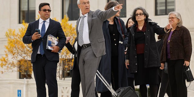 Attorney Seth Waxman, second from left, leaves the U.S. Supreme Court after oral arguments on Oct. 31, 2022, in Washington, D.C.