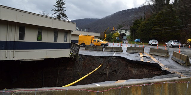 Authorities said the initial sinkhole was six feet wide and 30 feet deep.