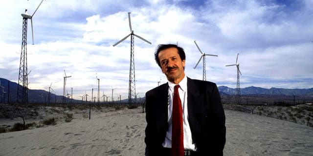 Sonny Bono stands before electricity generators in the desert plains of Palm Springs in 1991.
