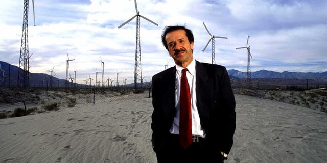 Sonny Bono stands before electricity generators in the desert plains of Palm Springs in 1991.