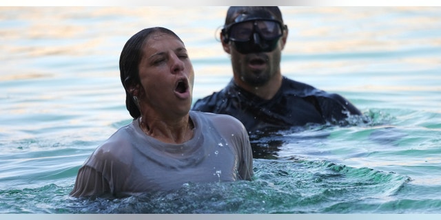 World Cup winner and Olympian, Carli Lloyd, catches her breath during one particularly challenging water test.