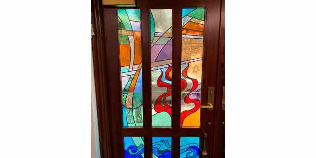 A stained-glass window in the New Light Memorial Chapel in Shaler, Pennsylvania, which includes three stars honoring the members of the New Light Congregation who were among the 11 victims of the Oct. 27, 2018, massacre.