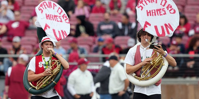 Nov 5, 2022; Stanford, California, USA; Stanford Cardinal marching band tuba players display a message on their instruments before the game against the Washington State Cougars at Stanford Stadium.