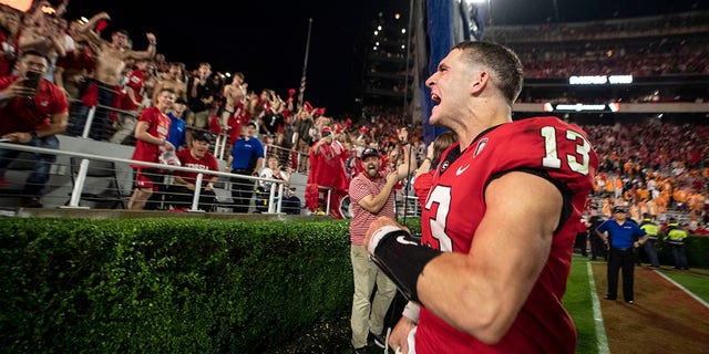 Georgia quarterback Stetson Bennett reacts to the crowd as he leaves the field following their victory over Tennessee, Saturday, Nov. 5, 2022.