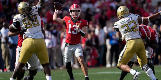 Georgia quarterback Stetson Bennett (13) throws a pass during the first half against Georgia Tech, Nov. 26, 2022, in Athens, Georgia.