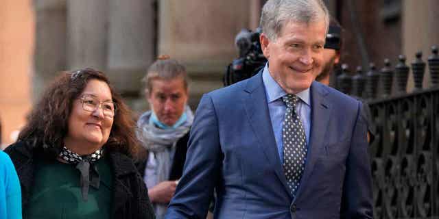 Steve Johnson, right, and his wife Rosemarie arrive at the Supreme Court in Sydney, Australia, on May 2, 2022, for a sentencing hearing in the murder of Steve's brother. An appeals court overturned the conviction of Scott White, who temporarily admitted to murdering Scott Johnson, on Nov. 18, 2022.