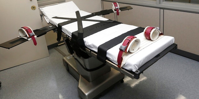 FILE - This photo shows the gurney in the execution chamber at the Oklahoma State Penitentiary in McAlester, Oct. 9, 2014. 