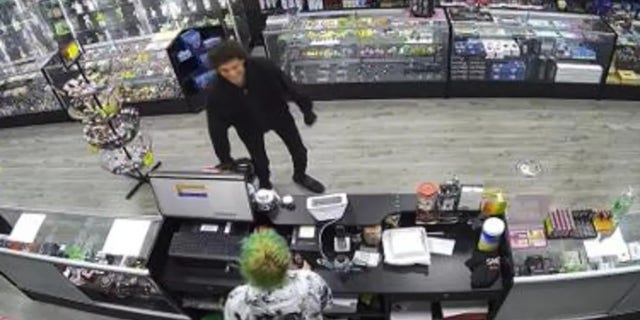 Georgia teen seen after taking off mask inside vape shop.
