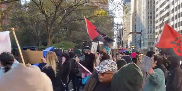 A crowd of transgender rights activists gathered Monday in New York City to protest against a speaking event they deemed as transphobic.