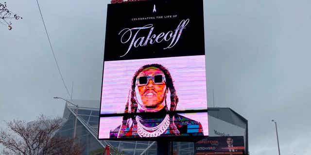 A sign announces the memorial service for slain rapper Takeoff at Atlanta's State Farm Arena on Friday, Nov. 11, 2022. He was a member of the hip-hop trio Migos. 