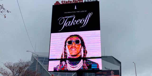 A sign announces the memorial service for slain rapper Takeoff at Atlanta's State Farm Arena on Friday, Nov. 11, 2022. He was a member of the hip-hop trio Migos.