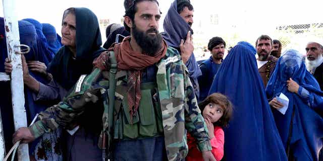 A Taliban fighter stands guard in Kabul, Afghanistan, on April 25, 2022. A U.N. experts committee has called for an investigation into the treatment of women in Afghanistan.