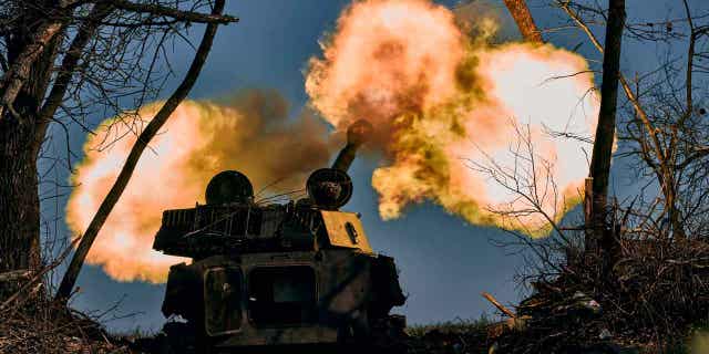 A self-propelled artillery vehicle fires near Bakhmut, Donetsk region, Ukraine, Wednesday, Nov. 9, 2022. 