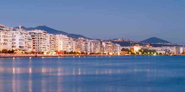 Dusk view of the waterfront and buildings on Nikis Avenue in Thessaloniki, Greece. Thessaloniki police arrested a German man with four outstanding warrants on Thursday.