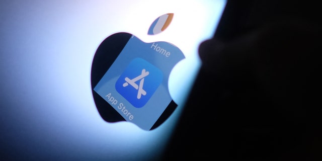 This photo illustration shows the Apple App Store logo reflected from an iPhone on the back of an iMac in Los Angeles, Aug. 26, 2021.