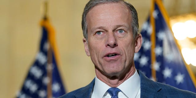 Sen. John Thune, R-S.D., talks with reporters on Capitol Hill in Washington on Jan. 20, 2022.