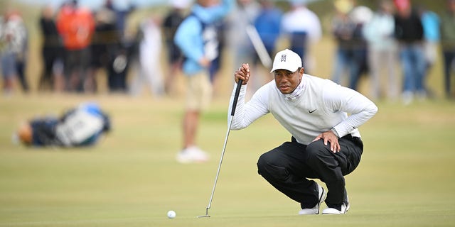 Tiger Woods hits a putt on the 11th green during the 150th Open at St Andrews Old Course on July 15, 2022 in Scotland.