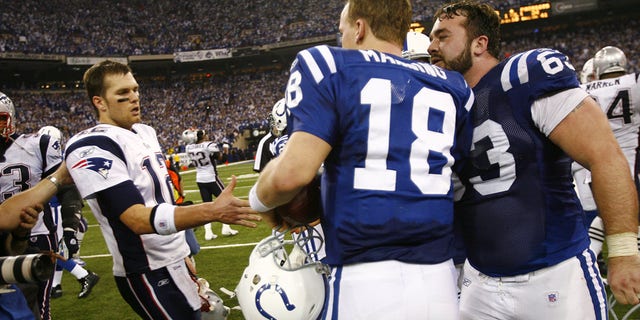 Quarterback Peyton Manning #18  and Jeff Saturday #63 of the Indianapolis Colts shake hands with Tom Brady after a game against the New England Patriots during the AFC Championship game on January 21, 2007 at the RCA Dome in Indianapolis, Indiana.