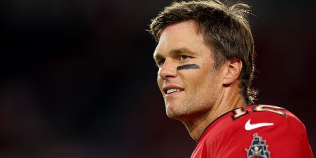 TAMPA, FLORIDA - OCTOBER 27: Tom Brady #12 of the Tampa Bay Buccaneers looks on during pregame warm-ups prior to a game against the Baltimore Ravens at Raymond James Stadium on October 27, 2022 in Tampa, Florida.