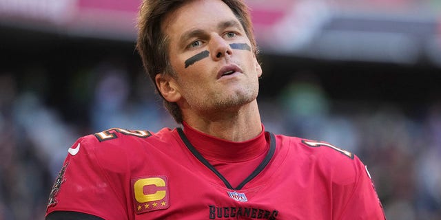 Tampa Bay Buccaneers quarterback Tom Brady warms up before an NFL football game against the Seattle Seahawks, Sunday, Nov. 13, 2022, in Munich, Germany.