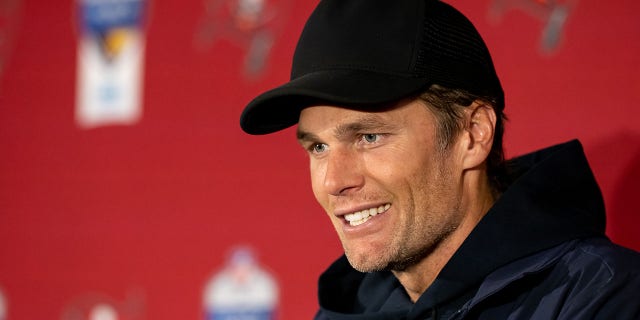 Tom Brady of the Tampa Bay Buccaneers speaks to reporters after a game against the Seattle Seahawks at the Allianz Arena in November. December 13, 2022 in Munich, Germany.