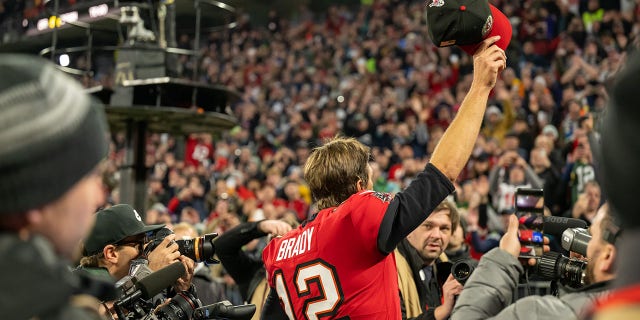 Tom Brady, #12 of the Tampa Bay Buccaneers, acknowledges the crowd after the final play of the NFL match between Seattle Seahawks and Tampa Bay Buccaneers at Allianz Arena on Nov. 13, 2022 in Munich.