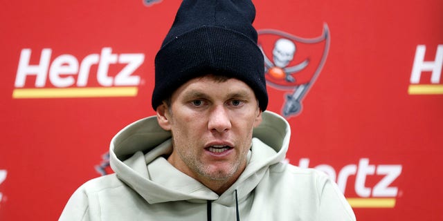 Tampa Bay Buccaneers quarterback Tom Brady meets with reporters following the team's NFL football game against the Cleveland Browns on Sunday, Nov. 27, 2022, in Cleveland.