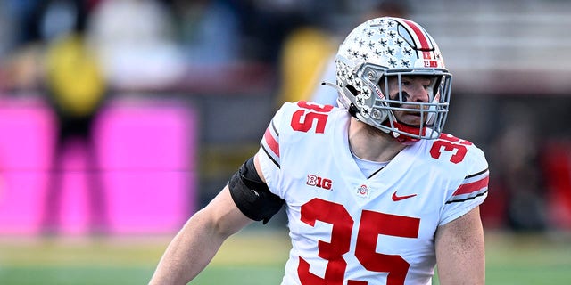 Tommy Eichenberg of the Ohio State Buckeyes defends against the Maryland Terrapins at SECU Stadium Nov. 19, 2022, in College Park, Md.