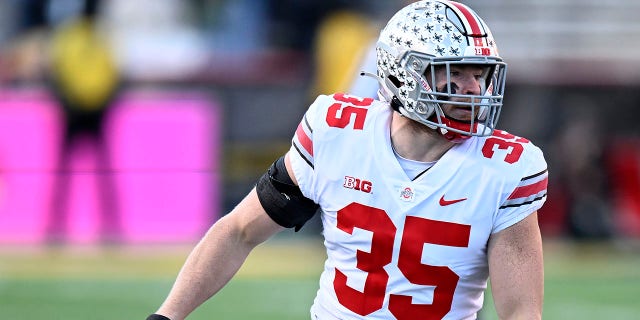 Tommy Eichenberg of the Ohio State Buckeyes defends against the Maryland Terrapins at SECU Stadium on November 19, 2022, in College Park, Md.