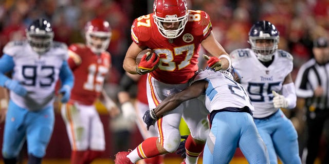 Kansas City Chiefs tight end Travis Kelce (87) is stopped by Tennessee Titans cornerback Roger McCreary during the second half of an NFL football game Sunday, Nov. 6, 2022, in Kansas City, Mo.