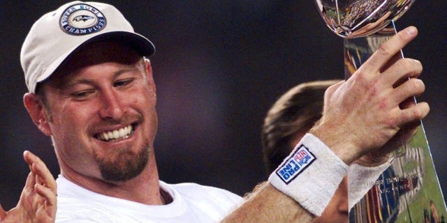 FILE - Trent Dilfer holds the Lombardi Trophy in 2001.