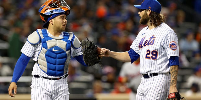 Francisco Alvarez and Trevor Williams (29) of the New York Mets celebrate as they walk off the field in the second inning against the Washington Nationals at Citi Field Oct. 5, 2022, in the Flushing neighborhood of the Queens borough of New York City.