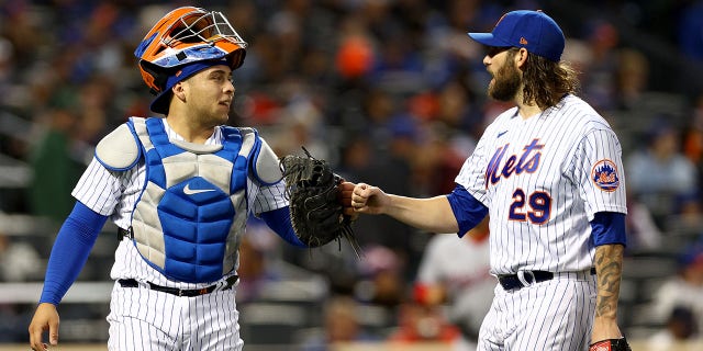 Francisco Alvarez and Trevor Williams (29) of the New York Mets celebrate as they walk off the field in the second inning against the Washington Nationals at Citi Field Oct. 5, 2022, in the Flushing neighborhood of the Queens borough of New York City.