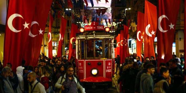 A tram rides past the spot of Sunday's explosion on Istanbul's popular pedestrian Istiklal Avenue in Istanbul, Turkey, on Nov. 14, 2022.