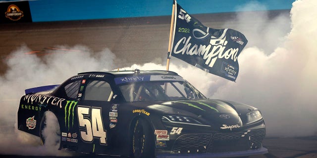 Ty Gibbs, driver of the No. 54 Monster Energy Toyota, celebrates after winning the NASCAR Xfinity Series Championship at Phoenix Raceway on Nov. 5, 2022, in Avondale, Arizona.