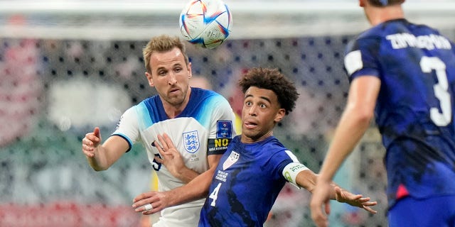 Tyler Adams vies for the ball
