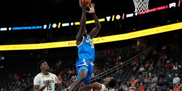 UCLA's Adem Bona, left, fouls Baylor's Dale Bonner during the first half of an NCAA college basketball game Sunday, Nov. 20, 2022, in Las Vegas.