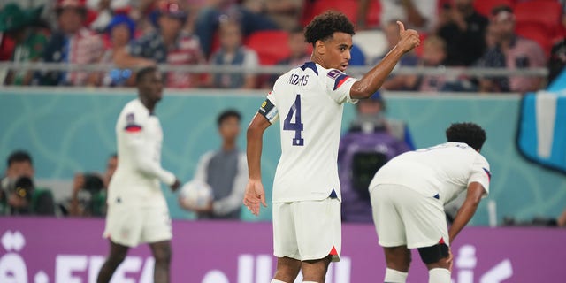 Tyler Adams (4) of the United States acknowledges the coaches during a FIFA World Cup Qatar 2022 Group B match against Wales at Ahmad Bin Ali Stadium on November 21, 2022 in Doha, Qatar.