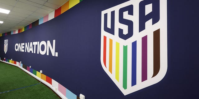 The U.S. national team's badge in support of LGBTQ+ people is seen in a room used for briefings.