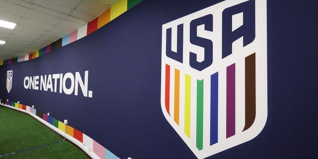 The U.S. national team's badge in support of LGBTQ+ people is seen in a room used for briefings.