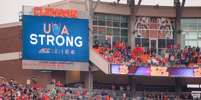 The University of Virginia honors slain football players before an NCAA college football game against Miami on Saturday, Nov. 19, 2022, in Clemson, SC.
