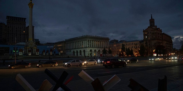 FILE: Cars pass Independence Square at dusk in Kiev, Ukraine on Monday, October 31, 2022.