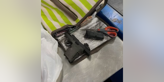 FILE - Fort Lauderdale airport security officers made the discovery recently, saying on Twitter that the weapon was found wrapped inside the packaged raw chicken.