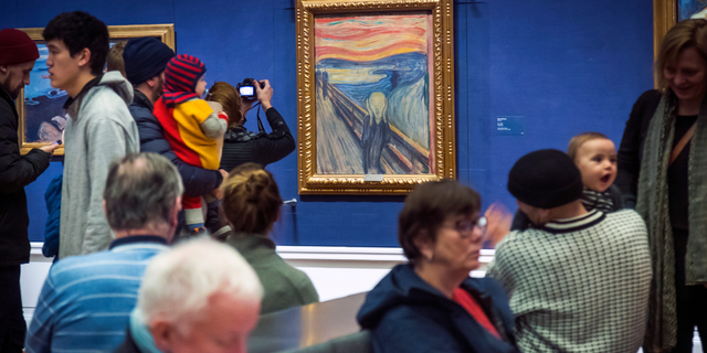 People watch by Edvard Munch "The scream" at the National Gallery in Oslo, Norway, Sunday 13 January 2019. On Friday 11 November 2022, activists from the organization '' Stopp oljeletinga '' (Stop Oil Exploration) tried to glue themselves to the frame of the painting. 