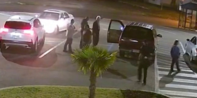 The Tarrant Police Department released video showing Bryant striking Newton one time in a parking lot following a council meeting, which the report describes as contentious.