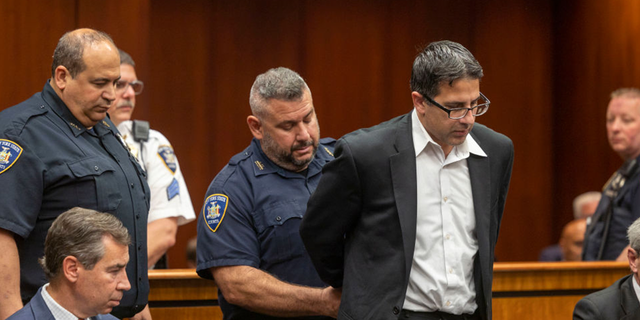 Former NYPD officer Michael Valva is handcuffed after the guilty verdict was read during his trial at Suffolk Criminal Court in Riverhead, New York.