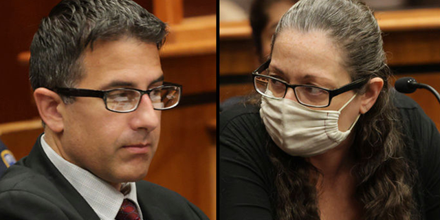 Michael Valva and Angela Pollina sit together inside Suffolk County Supreme Court Judge William Condon's courtroom for their murder trials in Riverhead, New York on Sept. 12.